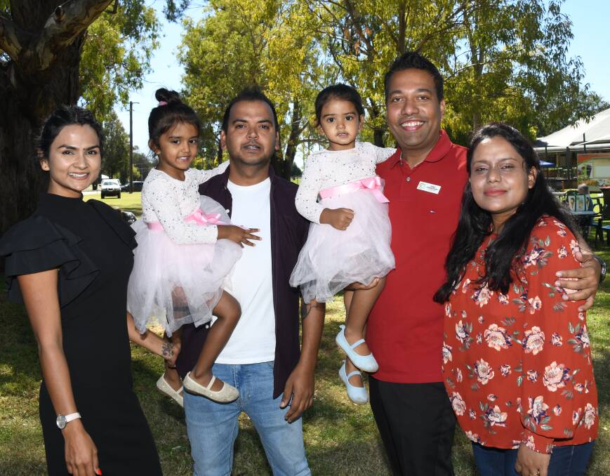 Dubbo councilor Shibli Chowdhury (2nd from right) with his wife and the Sharma family who are among the successful migrants in the region. Picture by Amy McIntyre