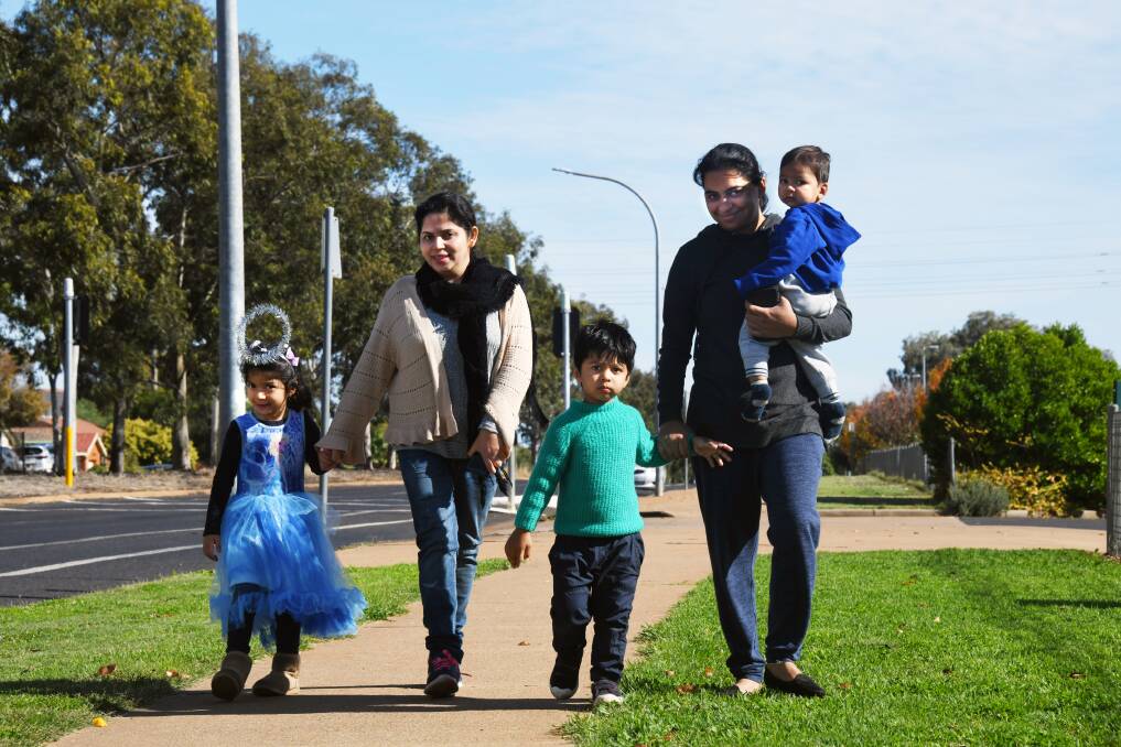 MUMS AND KIDS: (L-R) Sorath Niazuddin, her daughter Hoorain Niazuddin, 4, with Neelam Rani and her sons Dhruvdeep, 3, and Deviondeep, 1, walk to a community centre in east Dubbo.