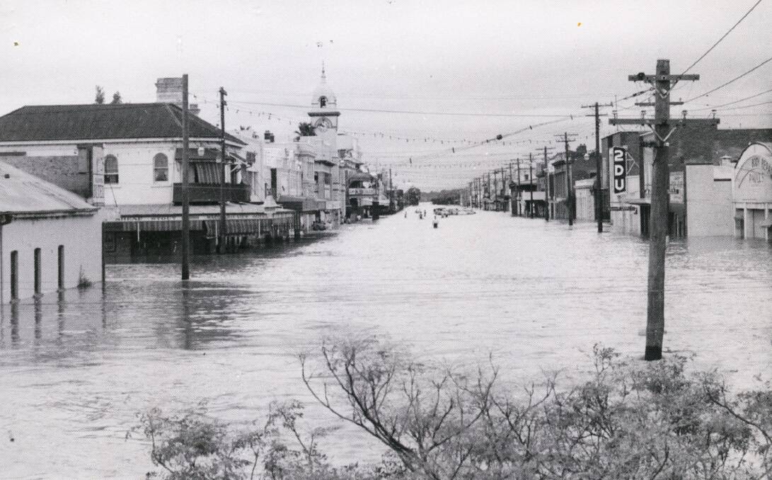View of Macquarie Street looking south during the 1955 flood. On the night of the 25 February 1955, large parts of Dubbo, including most of the CBD were flooded when the Macquarie River broke its banks after weeks of rain. The post office clock tower (now the Exchange building) can be seen on the left hand side. Picture: Local Studies Collection, Dubbo Regional Council