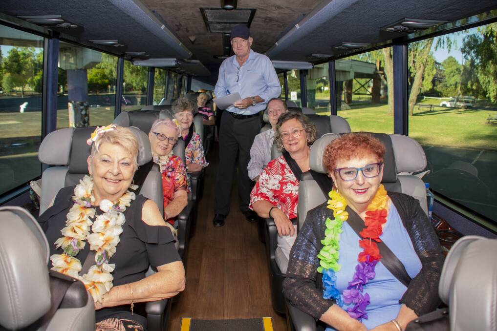 Rhonda Walters with Elsie Grcar, Shirley Marks, Tracy Lowe Driver, Jeff Marks, Susan Byers and Nola Hutchins on the bus to Parkes' Elvis festival. Picture by Belinda Soole