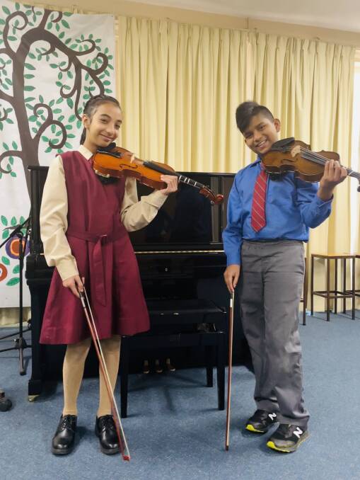 IN TUNE: (L-R) Violinists Achman Nirman and Sasvidu Warnakulasooriya were part of the winning ensemble. Picture: BAGESHRI SAVYASACHI