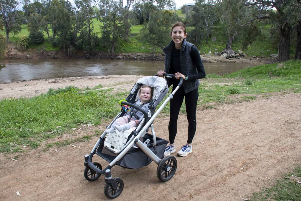 Miriam Morris with her daughter Lucy at Sandy Beach. Picture by Belinda Soole