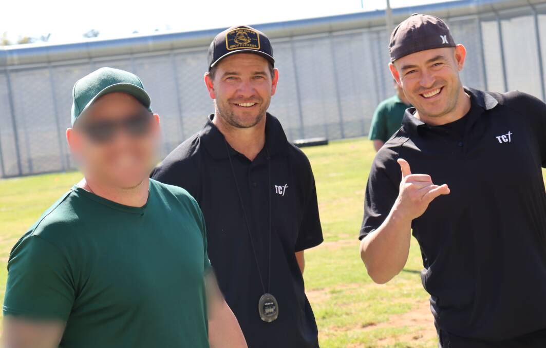 An inmate with former NRL star Terry Campese (right) and his colleague Jeremy Howell. Picture supplied