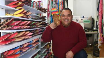 House of Avi owner, Avi Kumar, shows off his collection of juttis. Picture: Amy McIntyre