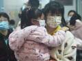 A mother and child wearing masks at a hospital in Hangzhou, Zhejiang province, China, on November 26, 2023. Picture by CFOTO/Sipa USA