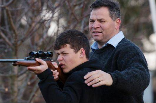 RESPONSIBILITY: Shooters, Fishers and Farmers Party member, Phil Donato with 13-year-old son Sean on their property outside Orange. Photo: JAMES BRICKWOOD