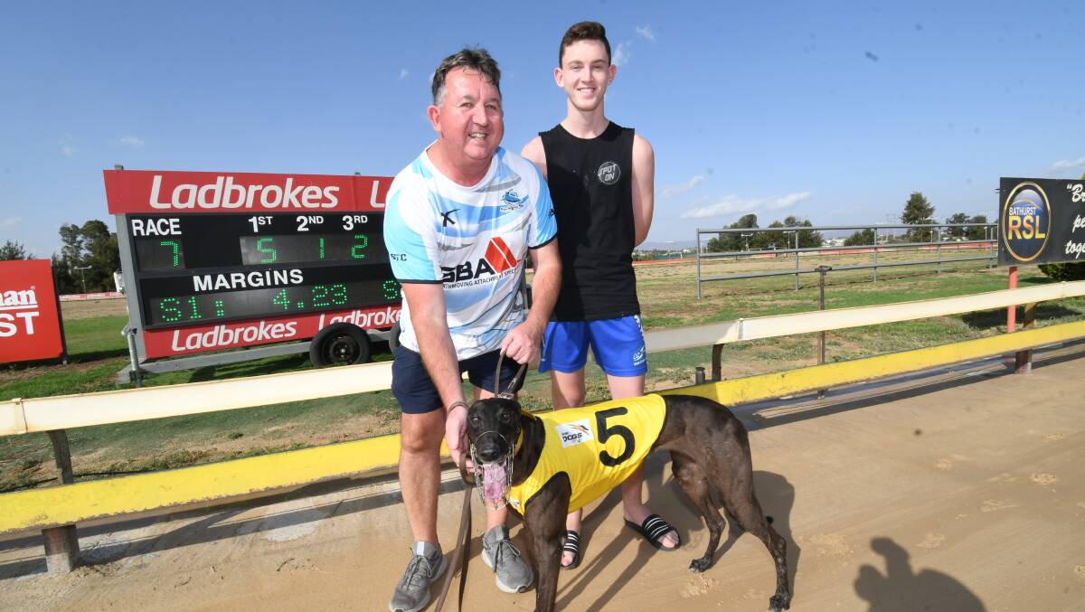 BIG WIN: Brian Jaggers and his son Tim with Solar Sky, after its Orange Cup heat win at Kennerson Park on Monday. Solar Sky will now run in the Orange Cup final next Monday. Photo: CHRIS SEABROOK