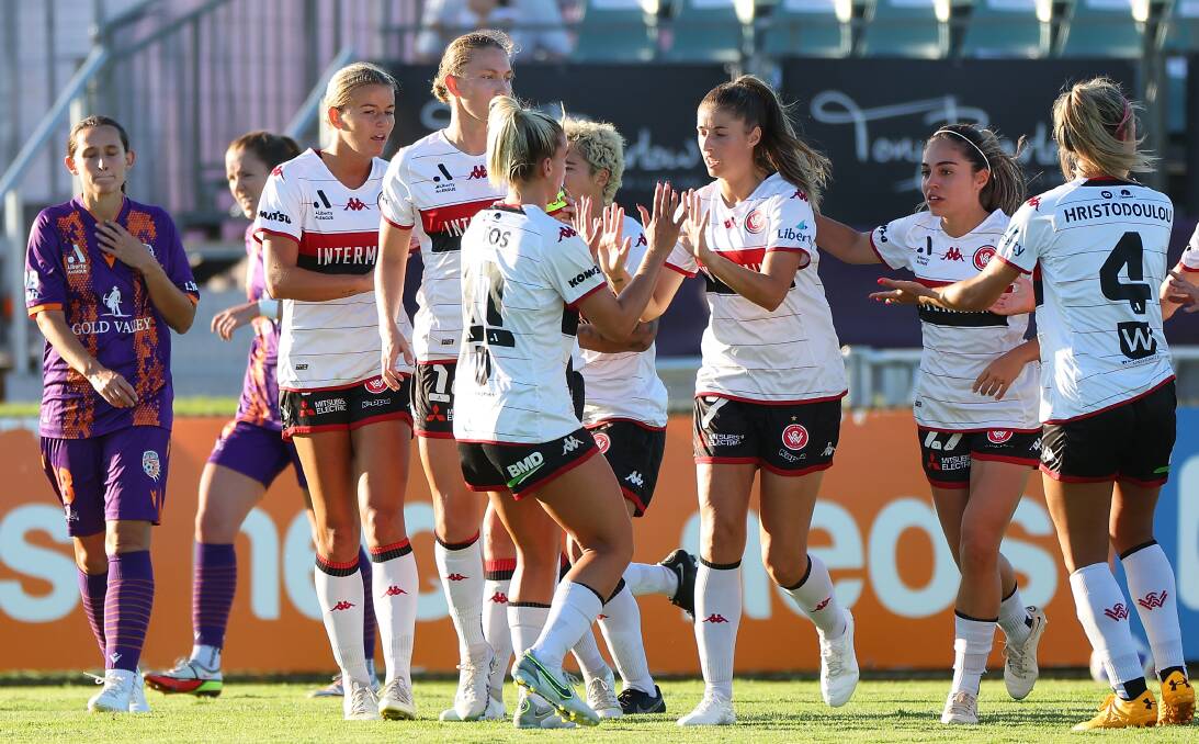 The Western Sydney Wanderers celebrate a goal in the 2022-23 A-League Women season. A women's game will be coming to Bathurst later this year. Picture by Getty Images