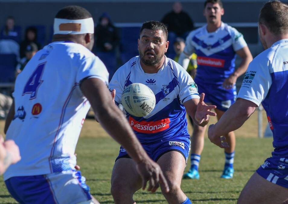 St Pat's halfback Willie Wright attempts a pass in Sunday's 22-18 loss to Parkes Spacemen on Sunday. Picture by James Arrow