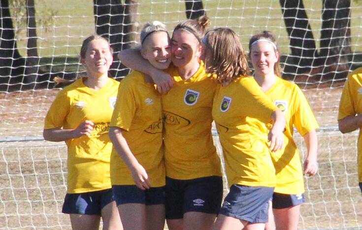 GOOD TIMES: Sarah Colman (centre) and Western players celebrate a goal. More female players across various divisions are needed ahead of the new campaign.