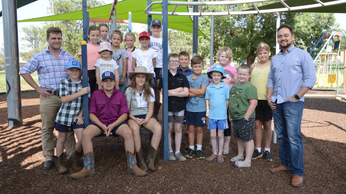 James Cleaver from the DPI Rural Resilience Program (left) and Matt March from NSW Health - Drought Support Team (right) with children from Yeoval on their way to Tullamore for the day on Wednesday. 