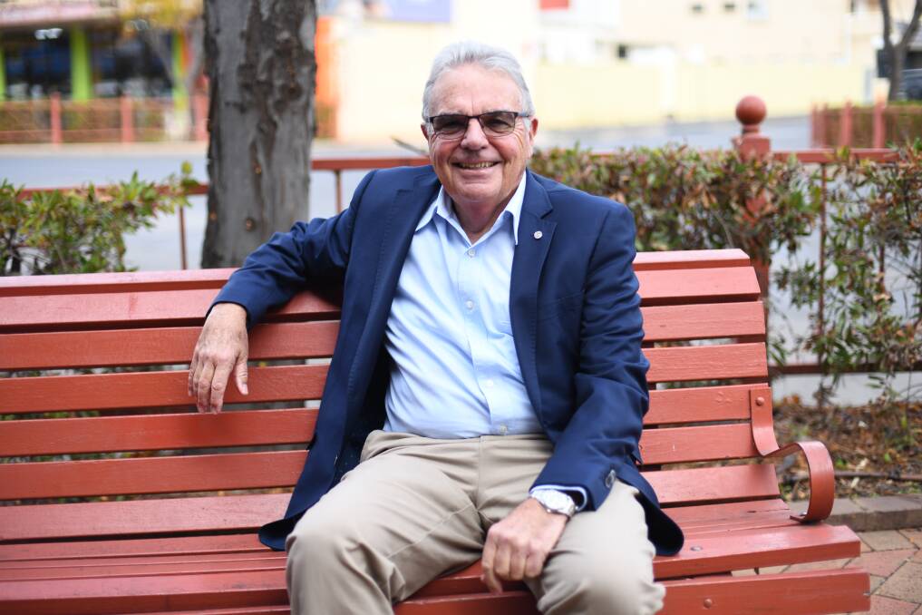 Order of Australia Medal recipient Michael White sitting and smiling outside in Dubbo. Picture: Amy McIntyre