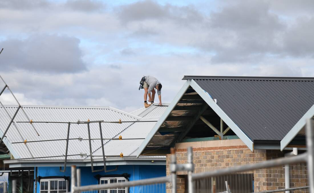 A tradesperson in Dubbo working on a house in the region. Picture: Amy McIntyre 