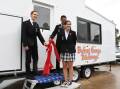 Allira Markcrow with Jim Richardson and Caleb Rasmussen unveil the tiny mobile cafe. Picture by Amy McIntyre 
