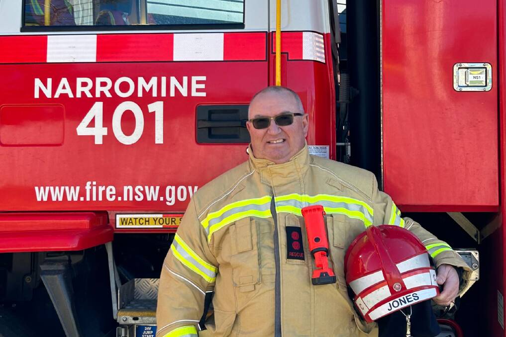 Narromine 401 Fire and Rescue captain Ewen Jones stands proudly in front of a fire truck. Picture supplied 
