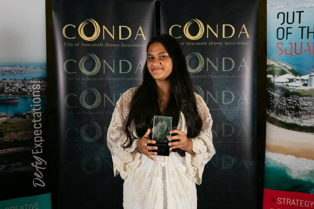 Symphony Riley with her CONDA award. Picture by Jamie Gilmore Studio 