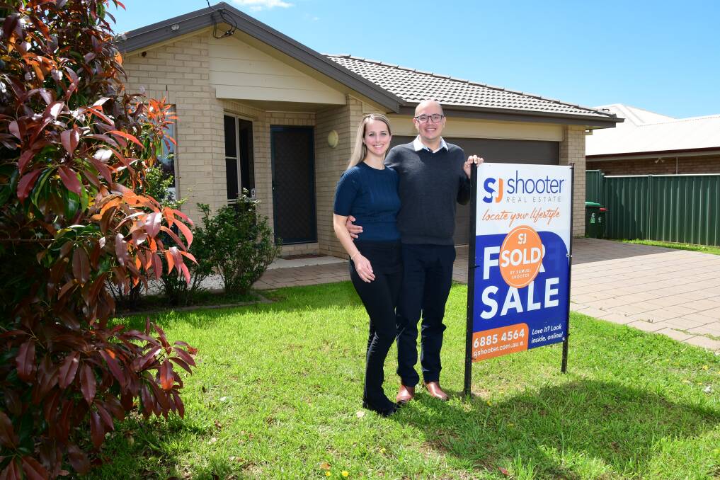 Laura and Samuel Shooter in front of a property they sold. Picture by Belinda Soole 