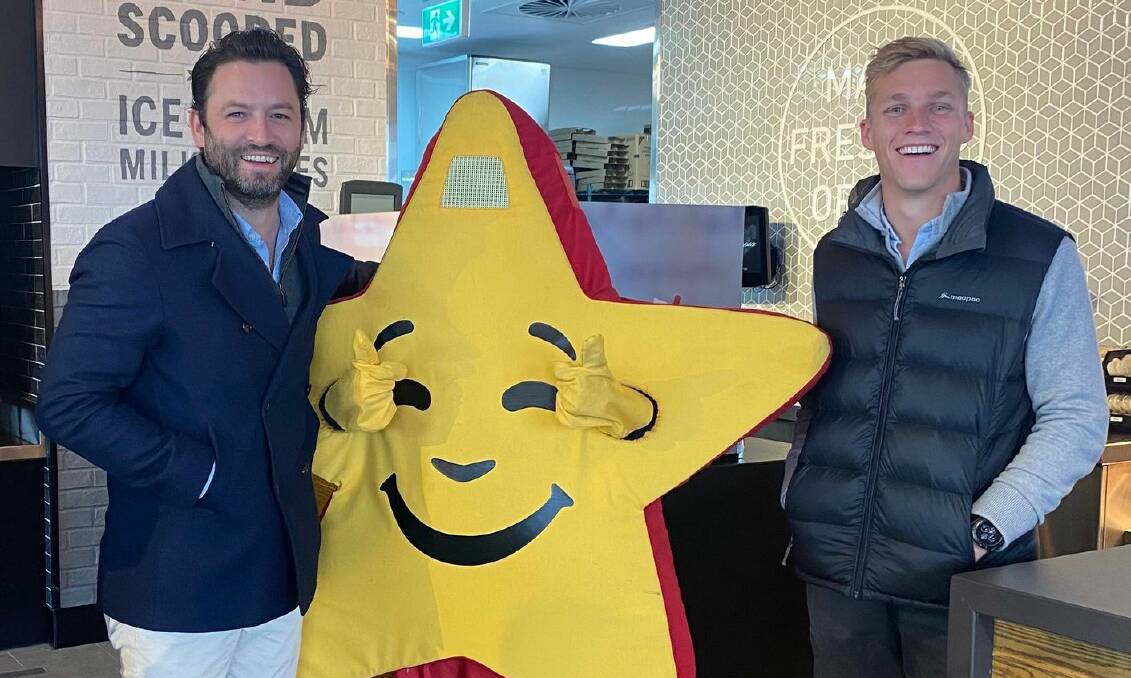 Steven's Group director Jason Capuano (left) and Corbin Bond (right) at the opening of the Carl's Jr restaurant. Picture: Supplied. 