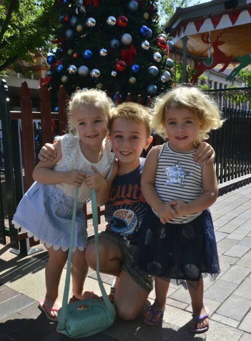 Big brother Kobi Kelleher with sisters Willow and Iyla love the Christmas decorations on Macquarie Street. They can't wait to jump on the carriage for a horse drawn trip around the CBD. 