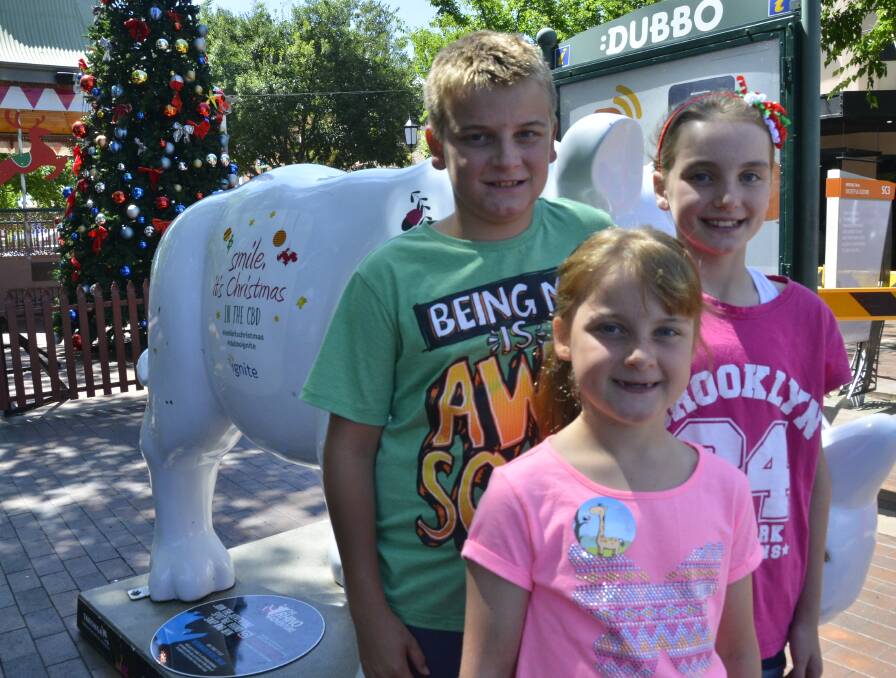 Siblings Hamish, Paige and Meg Lesslie are loving spending time these school holidays  and excited to get a visit from Santa tomorrow.