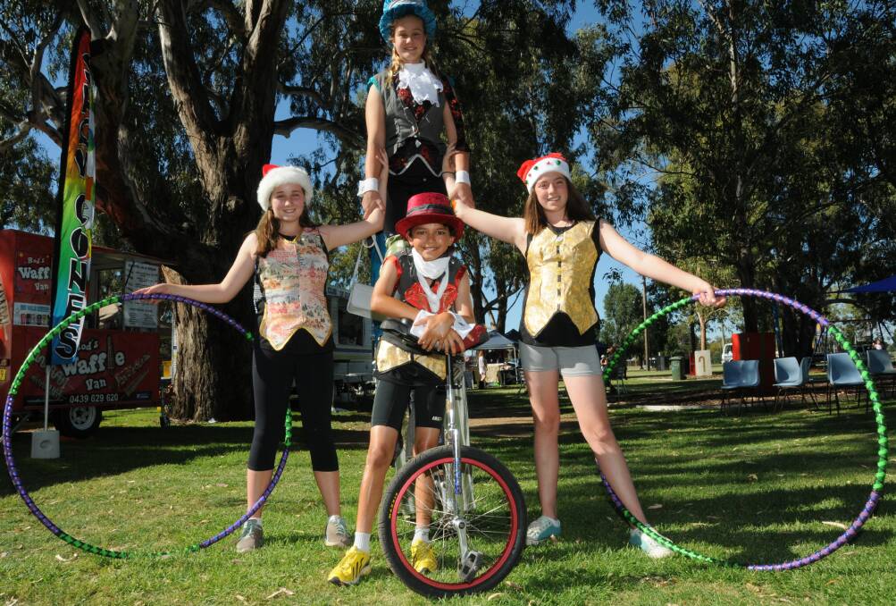 Circus West performers Hallie Bourke, Charlotte Root, Holly Shields and Zaden Burgess entertain at the Christmas Fair. Photo: PAIGE WILLIAMS