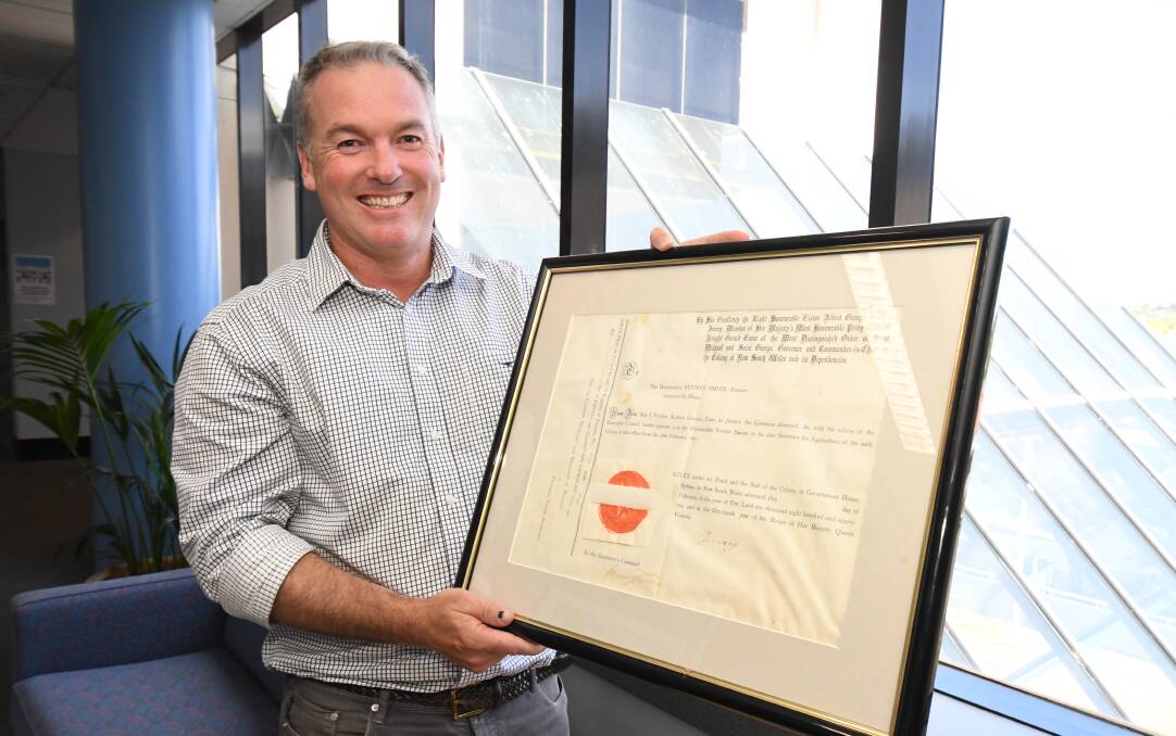 FLASHBACK: Department of Primary Industries director-general Scott Hansen with the document approinting the first secretary. Photo: JUDE KEOGH