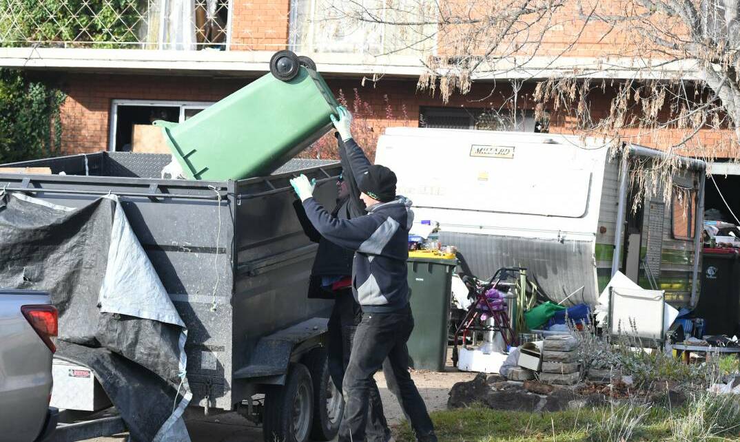 2018: Contractors remove rubbish during a previous clean-up.
