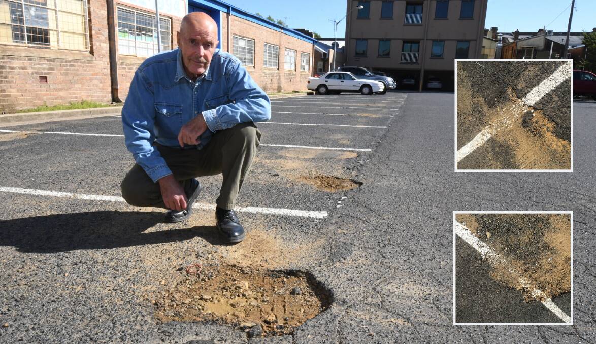POTHOLES: Steven Anderson in the car park off Peisley Street which he says has damage in urgent need of repair and potholes painted over (inset). Photo: JUDE KEOGH