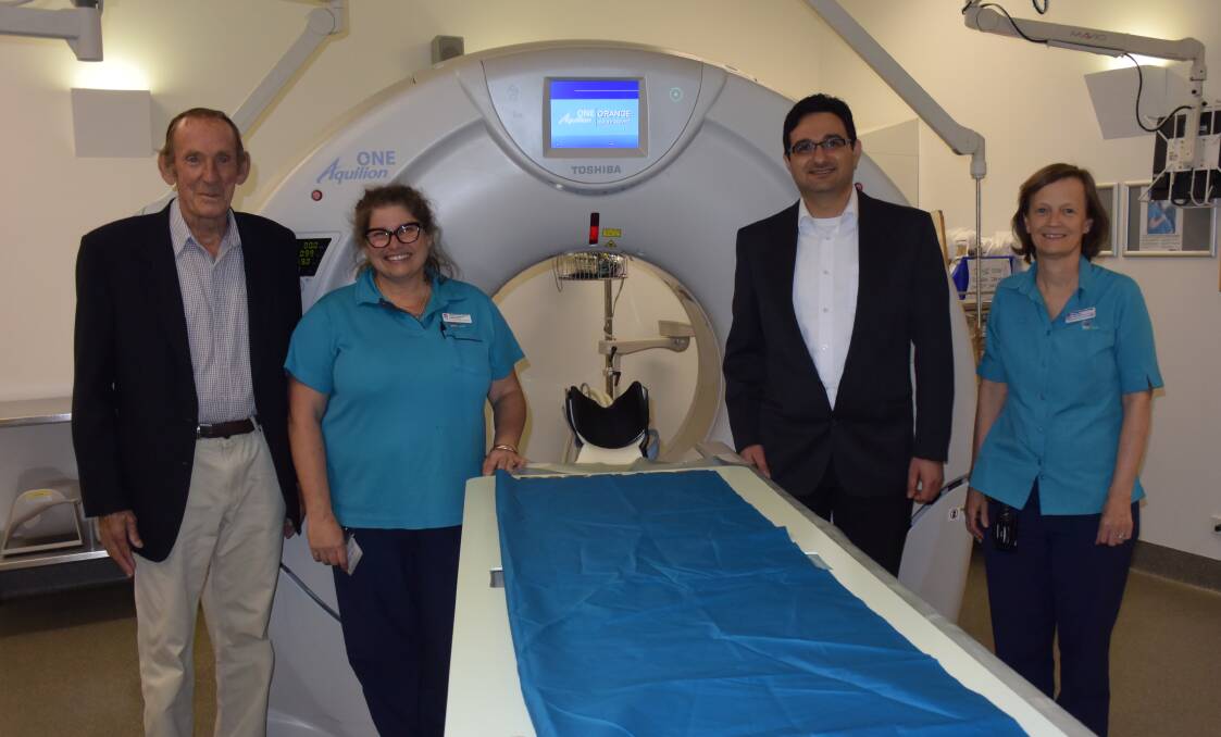 LIFE CHANGING: stroke sufferer Randall Wishart, radiographer Kerrie Brammall, Dr Rami Haddad and Fiona Ryan with the CT scanner at Orange hospital. Photo: DAVID FITZSIMONS 
