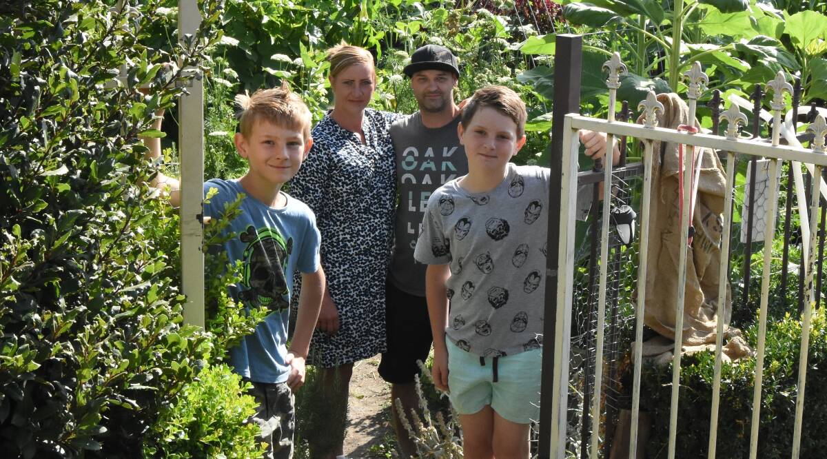 Green with envy: Bill Groves, Crystal Osborne, Chris Cochrane and Lachlan Groves in front of their very productive vegetable garden. 