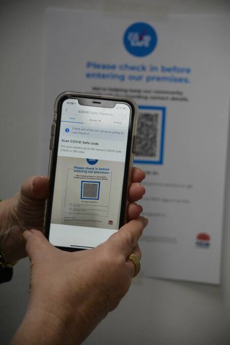 Looming: All visitors to all workplaces in NSW will be required to use the Service NSW QR code COVID-Safe check-in system from Monday. Photo: FILE