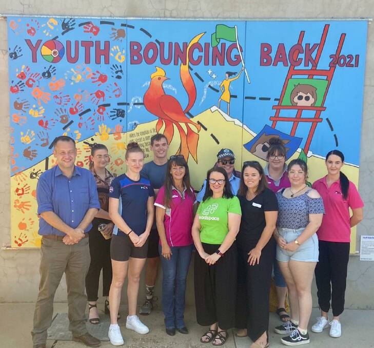 BOUNCING BACK: Representatives of each service in the Dubbo Youth Interagency along with Mayor for Dubbo Ben Shields (far left) at the launch of the new mural. Photo: CONTRIBUTED