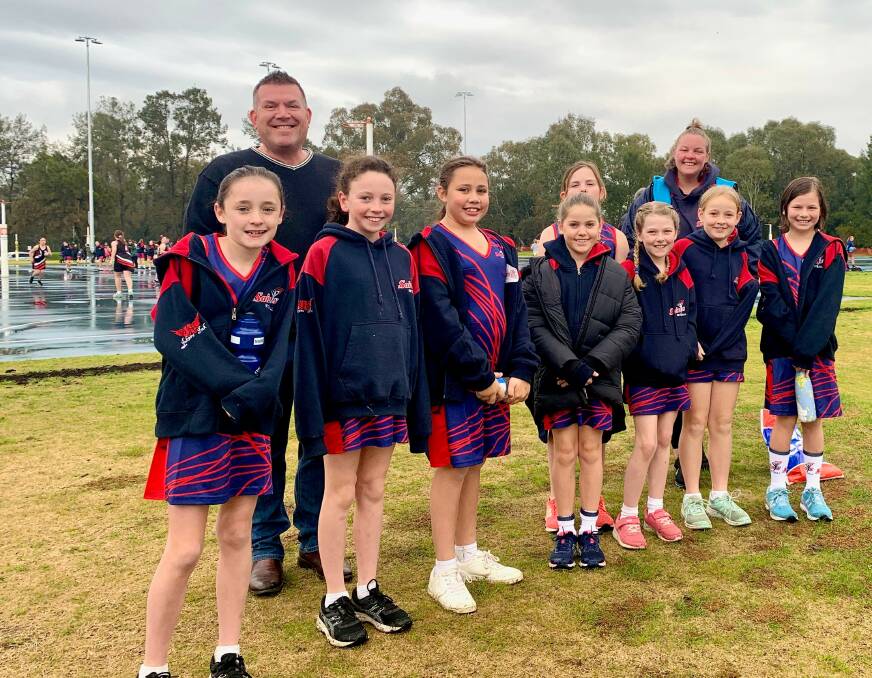 Member for the Dubbo electorate Dugald Saunders with some very happy young netball players on Saturday.