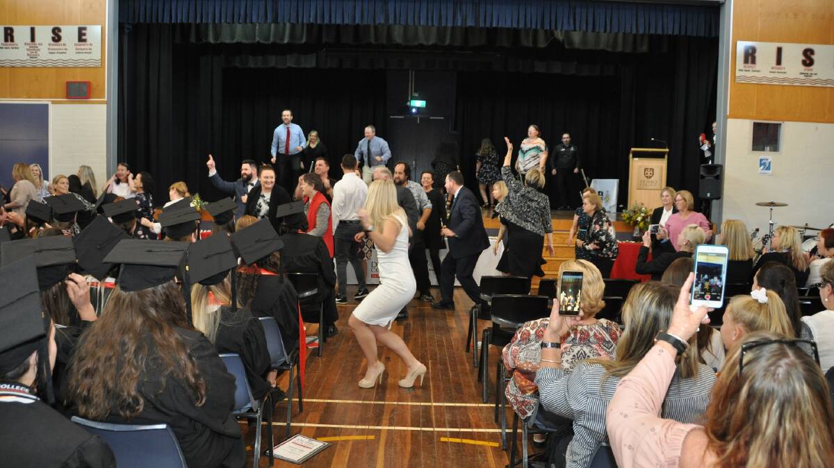 FLASH MOB: Teachers at Dubbo College surprise students with a flash-mob dance during their send-off. Photo: CONTRIBUTED
