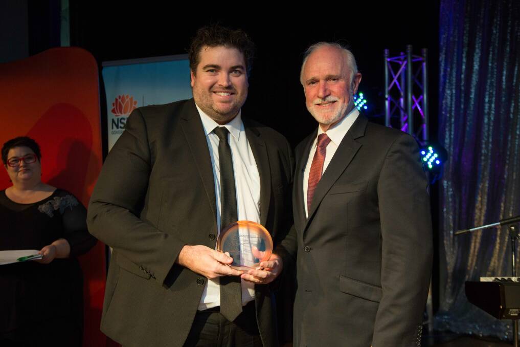 WINNER: Matthew Rouse (left) from Dubbo Hospital's Intensive Care Unit Governance Framework project accepting the award from our Western NSW Local Health District chairperson Scott Griffiths