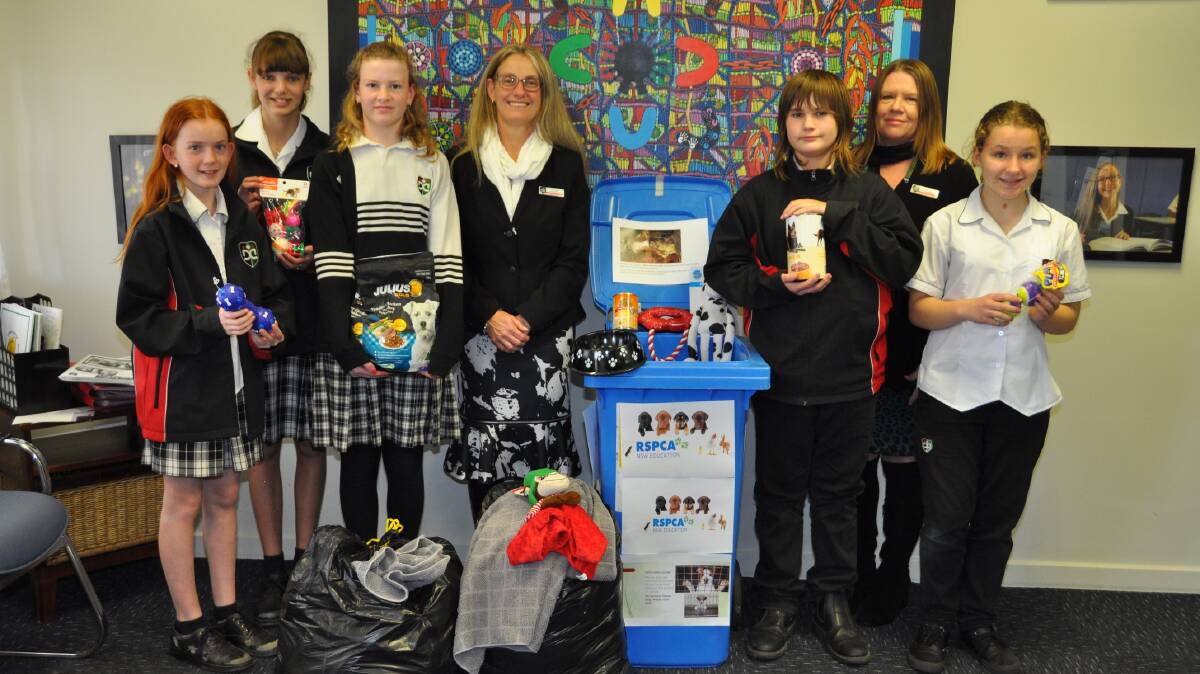 Dubbo College South Campus principal Suzie Foran and Year 7 adviser Wendy McLachlan with students Rose Purcell, Jessica Hall, Gemma Mills, Jarred Gundry and Elinor Wonderley and the collected pet care goods.