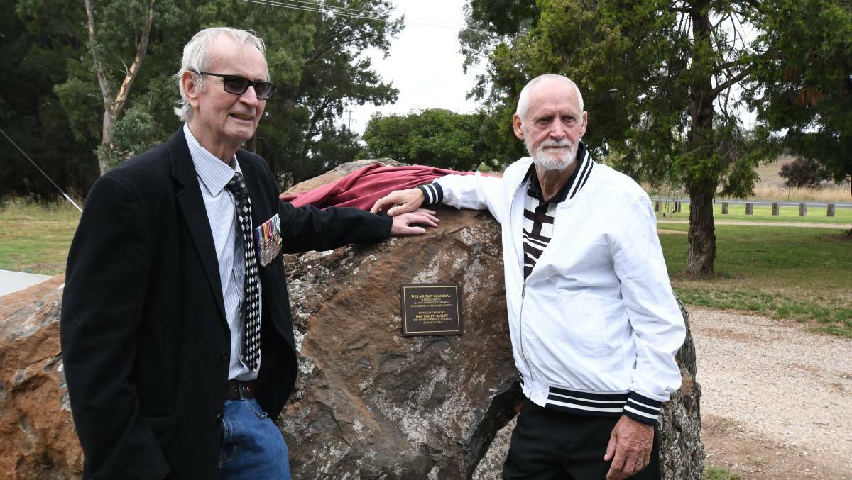  Fairbridge "kids", Ian 'Smiley' Bayliff and John Barron with the large rock that was recently moved to the commemorative park from the old Fairbridge Farm. Photo: Carla Freedman