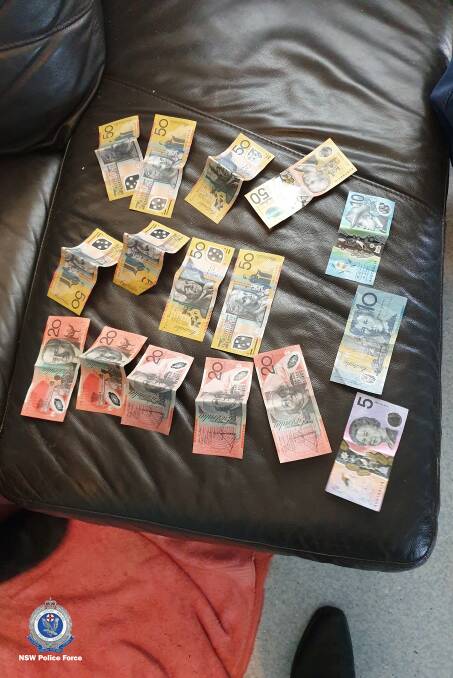 LOCATED: Officers executed a search warrant, locating and seizing cash, electronic control device and property alleged to be stolen. Photo: NSW POLICE MEDIA
