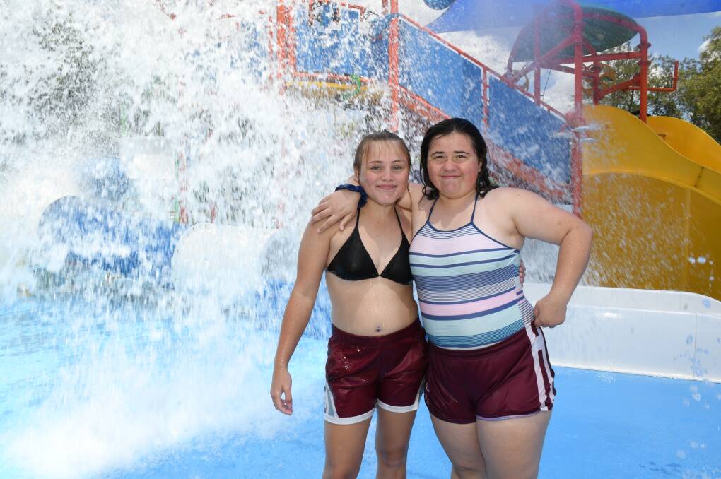 COOLING OFF: Kate and Brittany O'Neil enjoy a dip at the pool in their quest to cool off over summer. Photo: AMY MCINTYRE