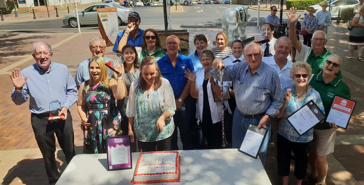 AWARDED: The Dubbo electorate award recipients cutting their cake. 
