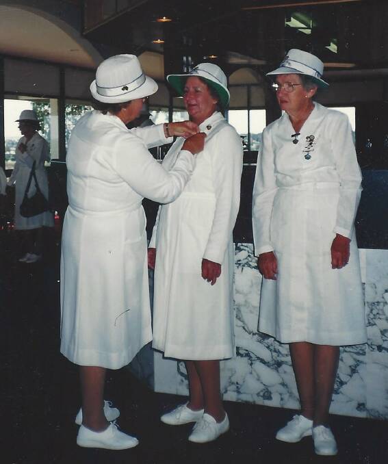 UMPIRE: Nell (on the right) received her umpires badge in 1988. 