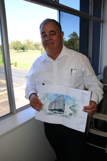 LONG-TERM VISION: John Walkom with plans for a $28 million unit complex development at the 1 Church Street site it will be built on back in 2017. Photo: FILE