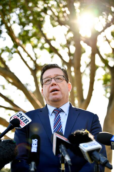 NSW Police Minister Troy Grant spoke during a press conference in Sydney, Thursday, July 12, 2018. Mr Grant is quitting politics and won't re-contest the 2019 state election for the seat of Dubbo, citing family reasons. Photo: AAP Image/Joel Carrett