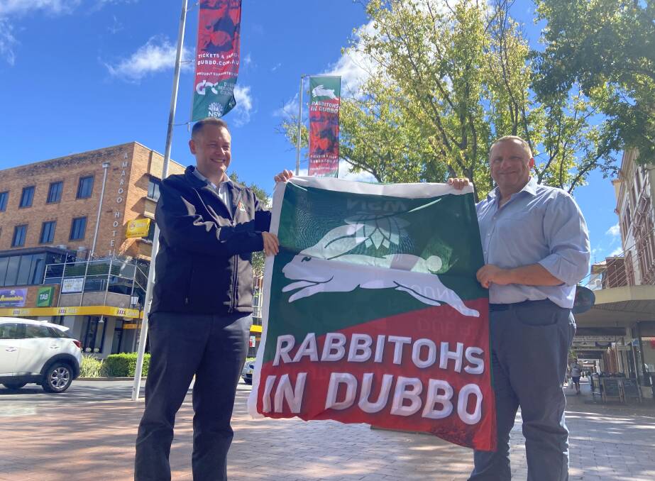 READY FOR THE GAME: Dubbo Regional Council mayor Ben Shields and councillor Greg Moore with the new flags, which are now flying in the CBD. Photo: CONTRIBUTED