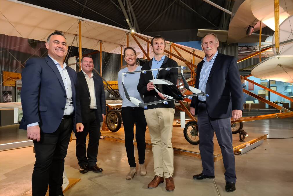 URGE TO RELOCATE: Deputy Premier John Barilaro, Member for the Dubbo electorate Dugald Saunders and Narromine mayor Craig Davies with Andrew Moore and Siobhan Lyndon from AMSL Aero, which is basing its flying car development and testing in Narromine. Photo: CONTRIBUTED