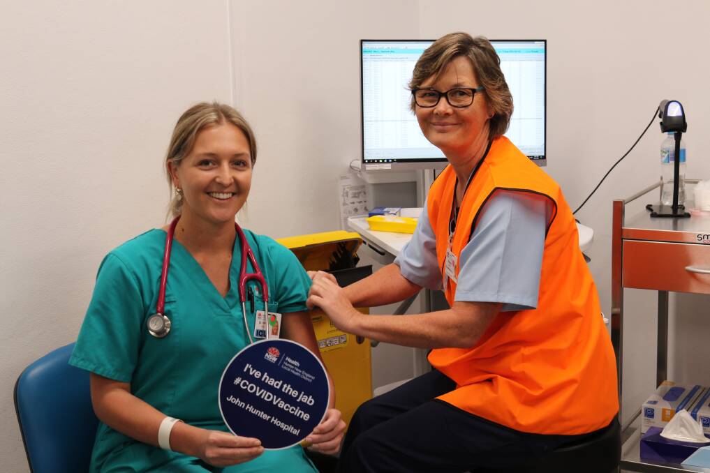 JAB ROLL OUT: John Hunter Hospital ICU specialist Dr Hannah Hall received a vaccination in Newcastle on Monday. It will begin in Dubbo on March 22. Photo: HNEH