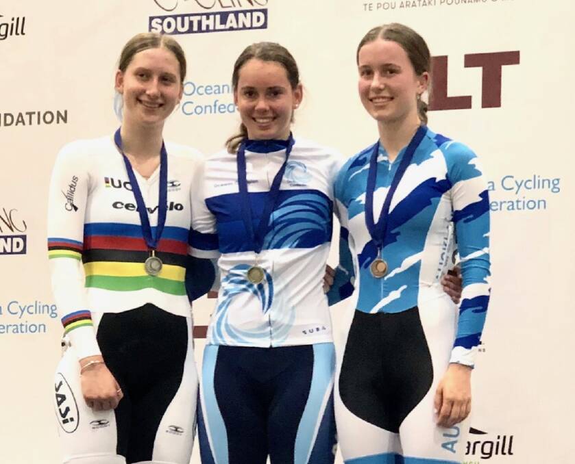 GOLDEN GIRL: Kalinda Robinson beat out 21 rivals, including world champion Ella Sibley (left) to claim gold in the junior women's scratch race.