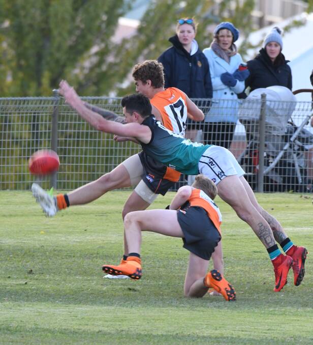 EFFORT: Bushrangers Outlaws' talent Paul Long throws himself into this attempted smother. Come Saturday that sort of effort will be needed against Central West AFL rivals Dubbo. Photo: PHIL BLATCH