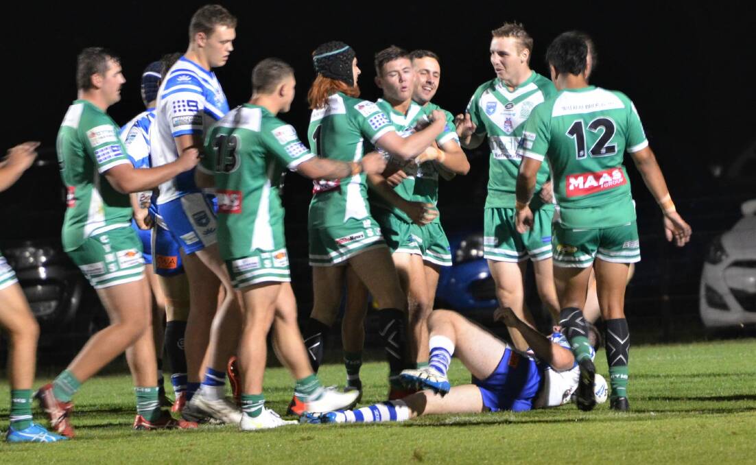 WELL DONE: CYMS players congratulate Jordi Madden after he scored the opening try of the Western Under 21s grand final. Photo: ANYA WHITELAW