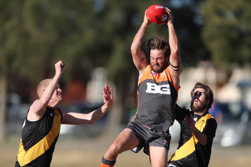 GOOD GRAB: Bathurst Giant Paul Jenkins takes a nice mark in Saturday's win over the Orange Tigers. He booted four majors for the match to take his tally for the season to 38. Photo: PHIL BLATCH
